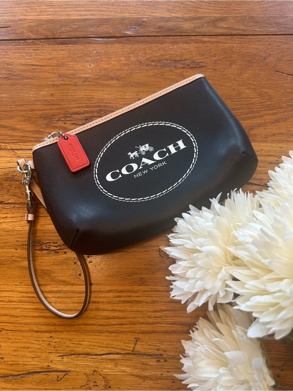 Coach Horse and Carriage Leather Medium Wristlet in black with red hang tag